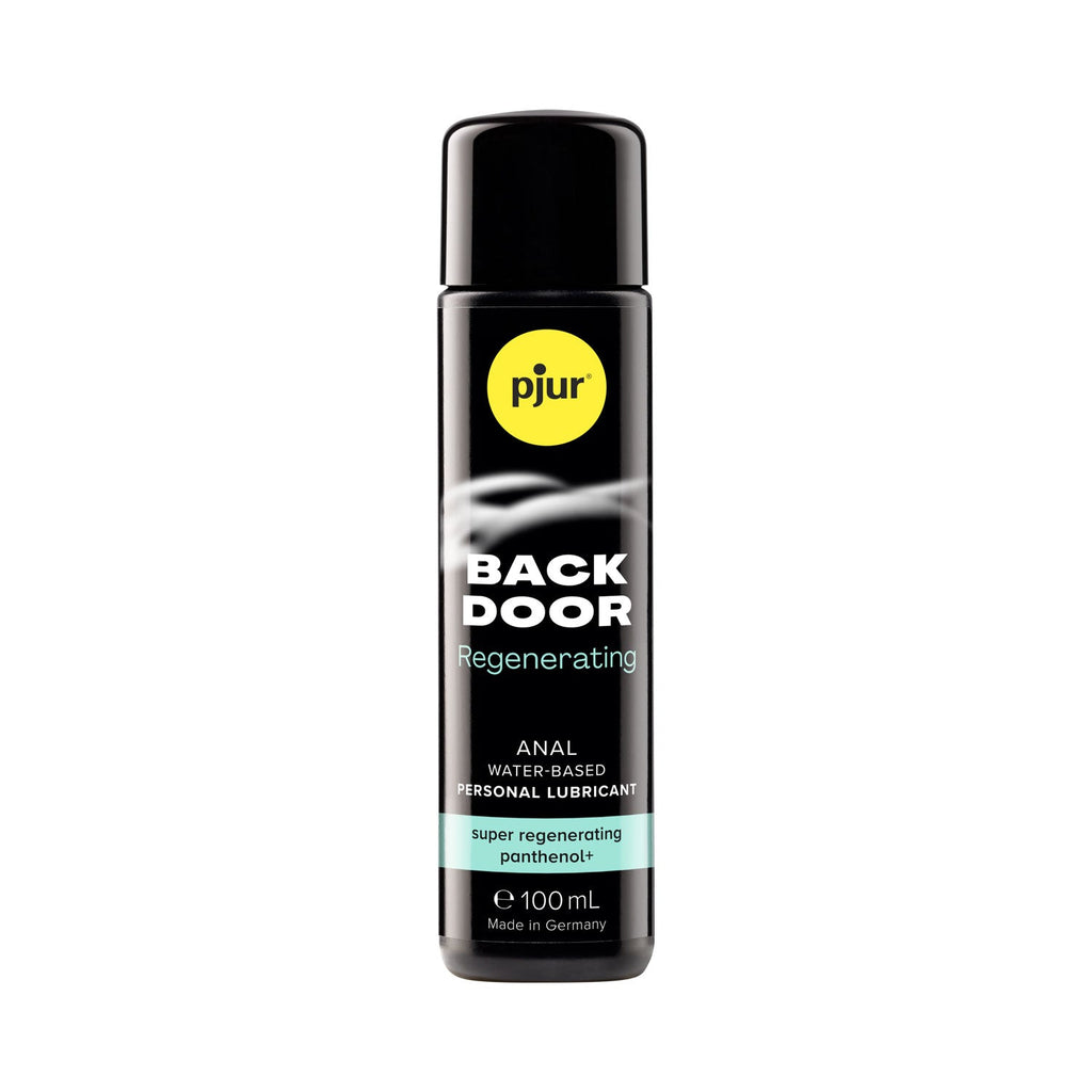 A black bottle of Pjur Back Door Super Regenerating personal lubricant with a label showing the product name and the fact that it is made in Germany. The bottle has a capacity of 100 ml.