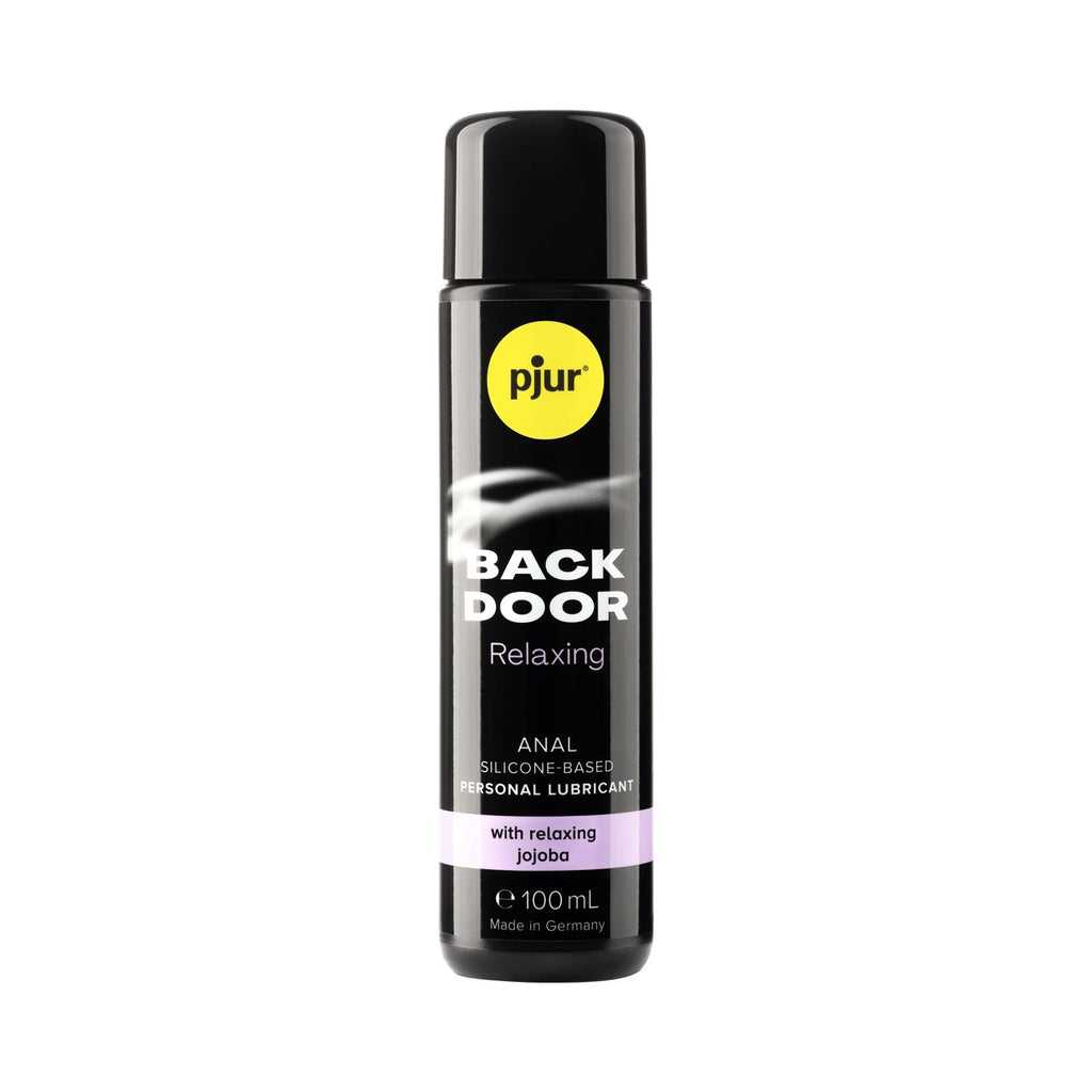Pjur Back Door Relaxing Anal Glide Silicone Based Lubricant in a black 100ml spray bottle with yellow and white labeling, indicating it is a personal lubricant with jojoba for skin hydration.