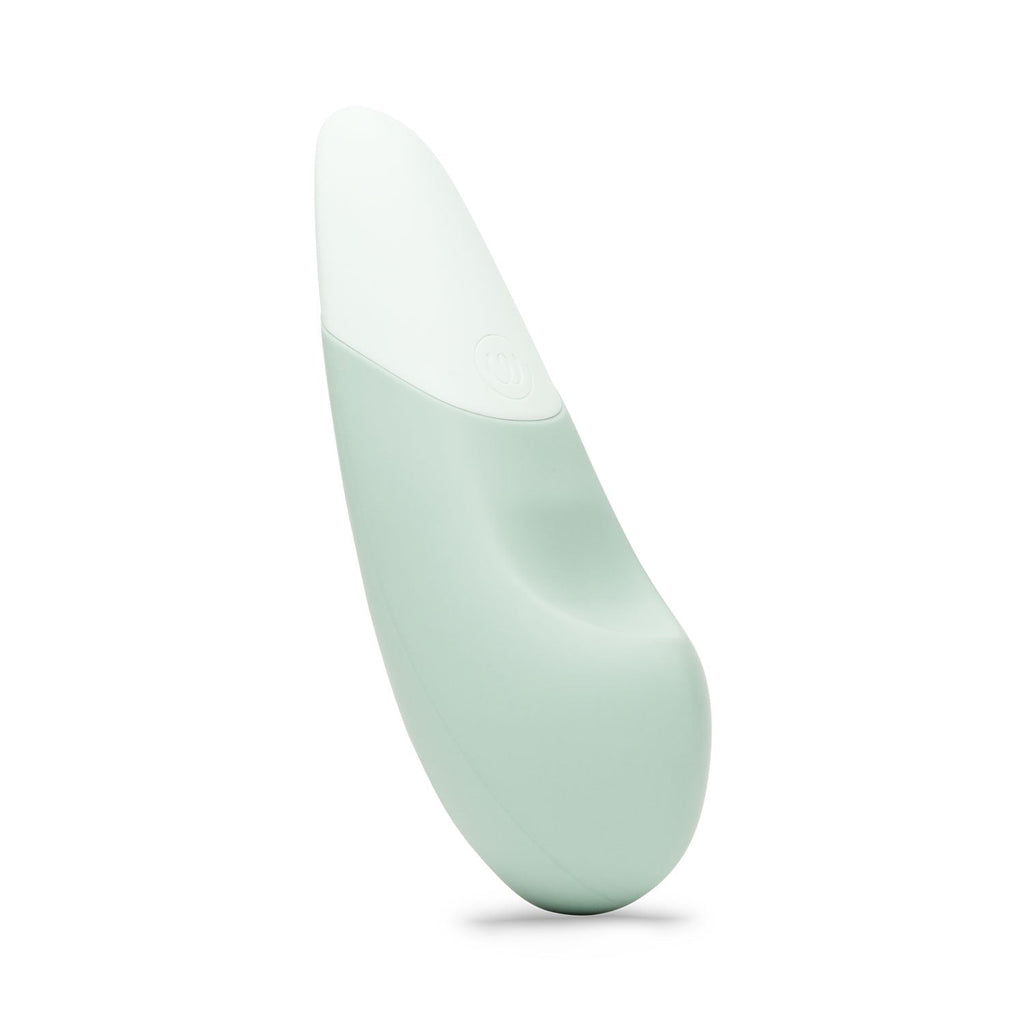 A sleek, light green clitoral vibrator with a smooth, ergonomic design.